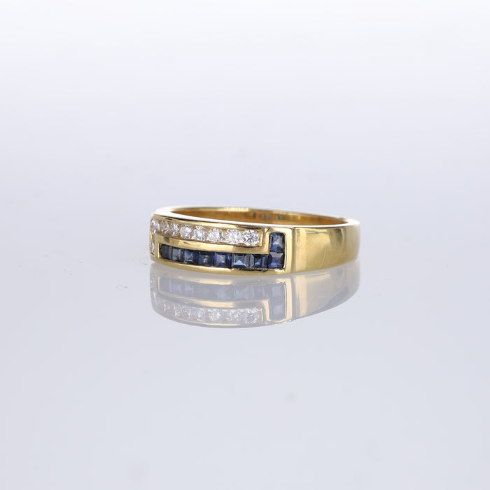 Anello fascia in oro giallo 18kt con zaffiri e diamanti