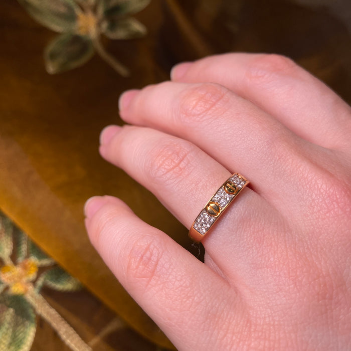 Anello in Oro Rosa con Sferine e Simbolo Infinito in Diamanti