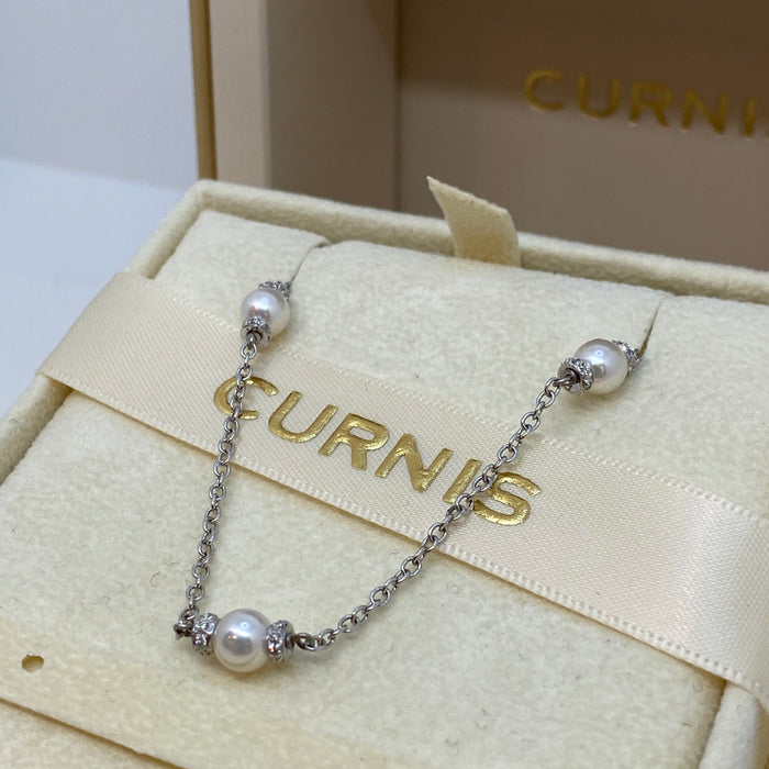 Chanel con diamanti e perle